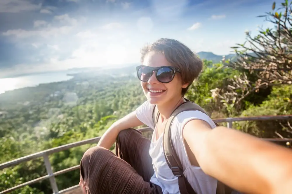 Solo female traveler enjoying a view during a trip